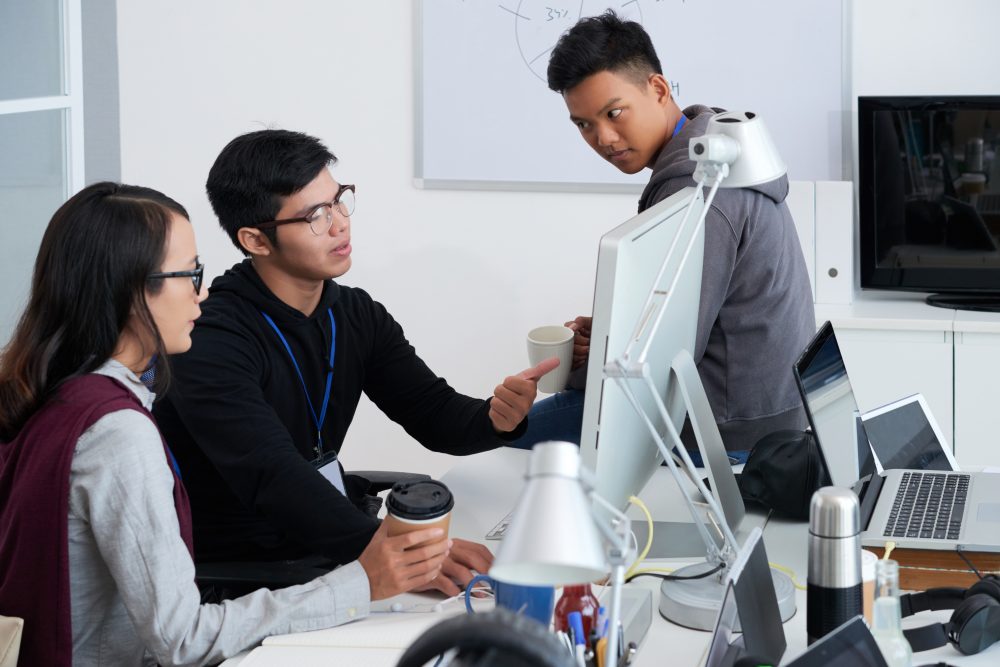 Professional developers discussing ideas for new project